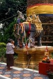 When Queen Chamadevi's great war elephant, Blacky Purple died, it was buried with great honour beneath a chedi which still stands near Lamphun railway station. Here, too, can be seen monuments to Chamadevi's swiftest horse, her favourite cat, and a special cockerel ‘which crowed so loud and shrill that it could clearly be heard as far as Lopburi’.<br/><br/>

Blacky Purple's monument, known locally as Ku Chang, is the most impressive of these monuments. The tall black chedi and neighbouring shrine are cluttered with wooden, plaster and stone elephants of every size and description. Fresh bananas and sugar cane are brought for the spirit of Blacky Purple every morning, and the frequent visitors offer lao khao (white liquor), pigs' heads, candles, incense and yellow chrysanthemum flowers.<br/><br/>

Lamphun was the capital of the small but culturally rich Mon Kingdom of Haripunchai from about 750 AD to the time of its conquest by King Mangrai (the founder of Chiang Mai) in 1281.